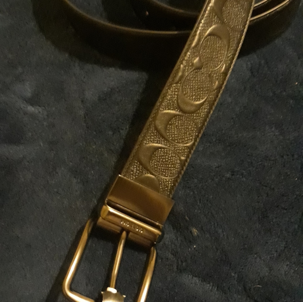 Mens black logo embossed cut to fit belt.